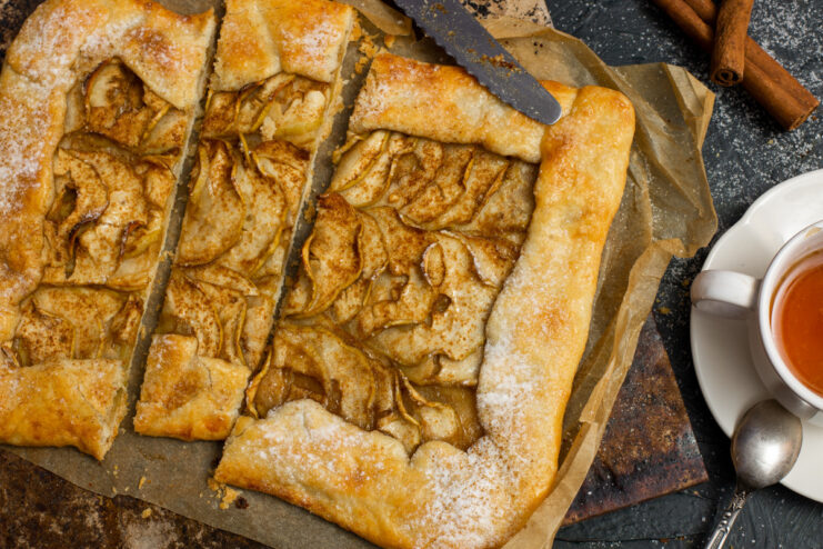 A rustic Lenten apple galette on a plate, dusted with powdered sugar.