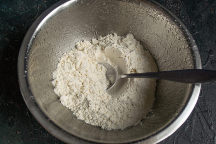 Measuring All-Purpose Flour for the Galette Dough A bowl of all-purpose flour ready for making the shortcrust pastry.