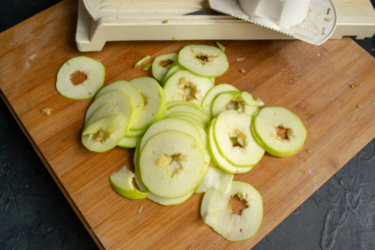 Slicing Fresh Apples for the Galette Filling Thinly sliced apples in a bowl for the galette filling.