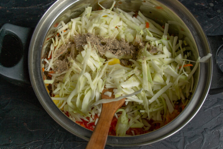 The Secret Ingredient: Mushroom Powder Mushroom powder being sprinkled into the pot of vegetables for the borscht.