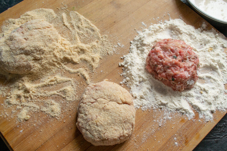 How to Shape Perfect, Evenly Sized Kotlety Hands shaping a raw meat patty (kotleta) before breading and frying.