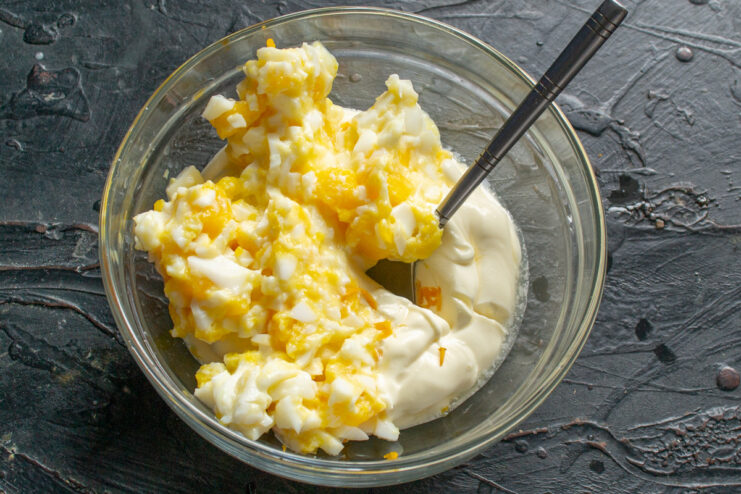 Step-by-Step: Making Homemade Tartar Sauce A bowl with mayonnaise, chopped eggs, and lemon zest, the base for homemade tartar sauce.