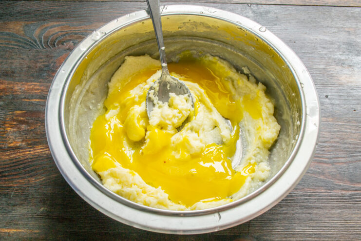 Separating Eggs for the Tart Three egg yolks in a bowl, separated from the whites, for the shortcrust pastry.