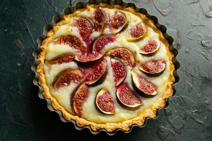 Baking the Tart to a Perfect Golden Brown The fig and custard tart baking in the oven, with a golden-brown crust.