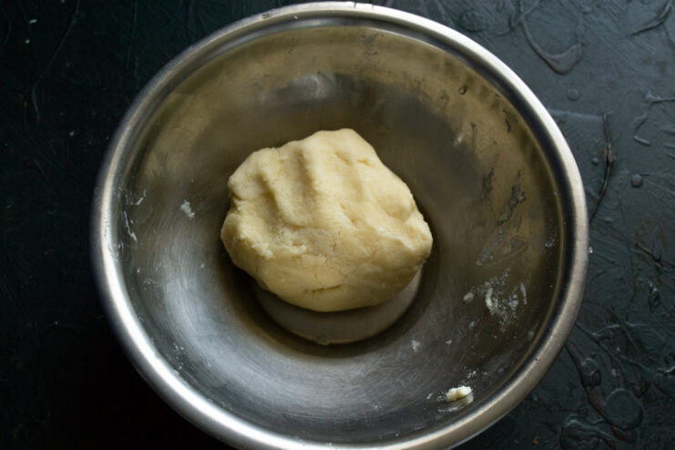 Forming the Pastry Dough Before Chilling A smooth ball of shortcrust pastry dough ready to be chilled.
