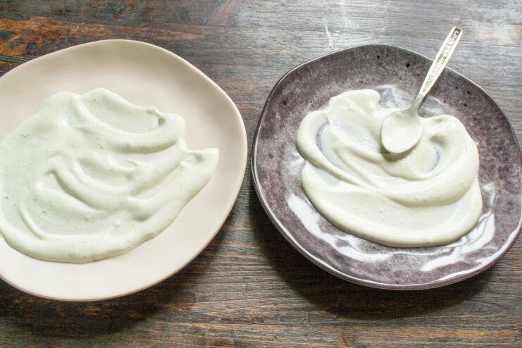 Preparing the Yogurt-Dill Sauce A bowl of Greek yogurt with dill and salt being mixed to create a sauce.