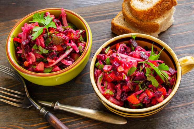 Serving the Delicious and Colorful Vinegret Salad A serving of finished vinegret salad in a white bowl, ready to be eaten.