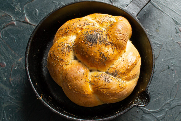 Step 14: Baking the Vitushka buns until golden brown. A golden-brown baked Vitushka bun being taken out of the oven.