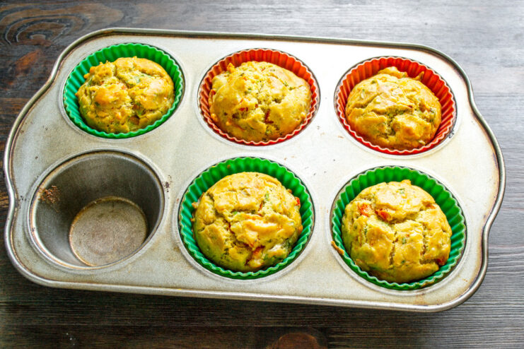 Baking the Savory Muffins for About 20 Minutes Until Golden A muffin tin with savory muffins baking inside a hot oven.