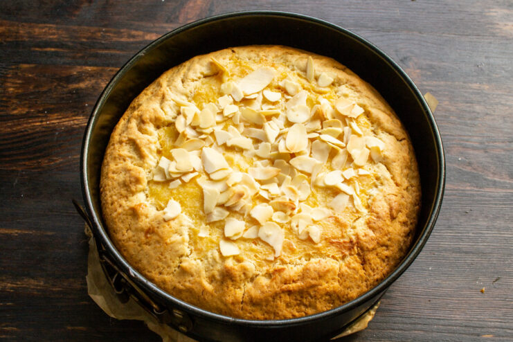 Baking the Pie Until Golden Brown The pumpkin and sour cream pie baking in the oven, with a golden-brown crust.