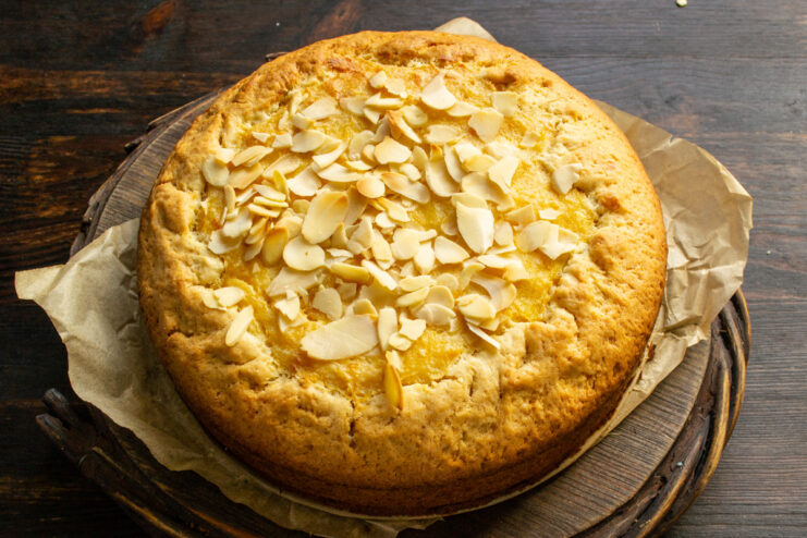 Serving the Chilled Pumpkin Custard Pie A fully baked and chilled pumpkin and sour cream custard pie being sliced for serving.