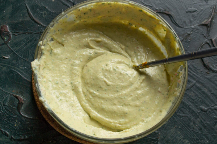 Step 5: Blending the salad to a smooth, creamy consistency. Using an immersion blender to mix the crab stick salad ingredients in a bowl until smooth.