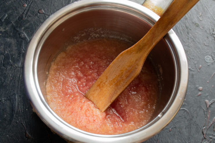 Cooking Down the Fruit Puree for the Perfect Zefir Base Apple and plum puree being cooked down in a saucepan to thicken.