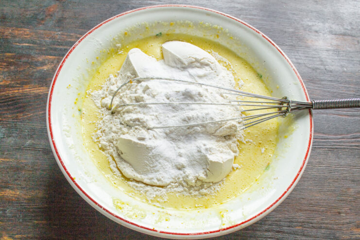 Whipping Eggs and Sugar Until Light and Fluffy Whisking eggs, sugar, and orange zest in a bowl until the mixture is light and fluffy.