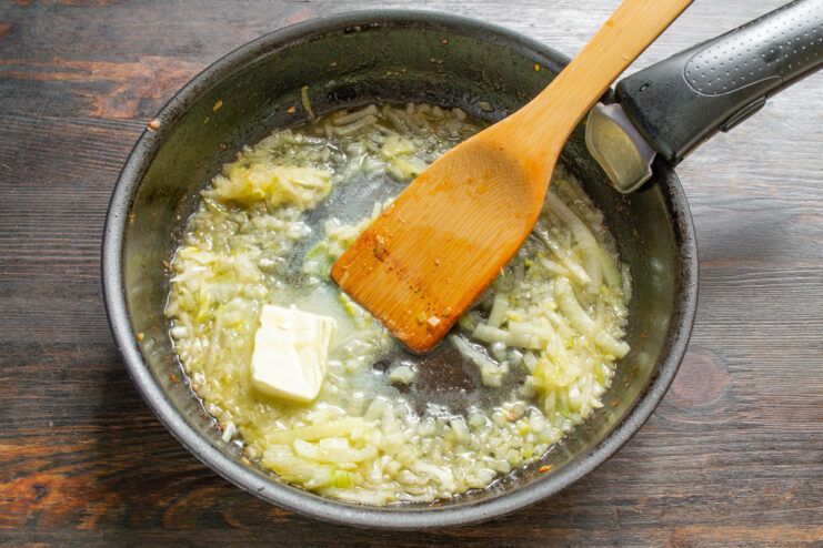 Starting the Creamy Sauce with Butter and Onions Melting butter in a clean skillet to start the creamy sauce.