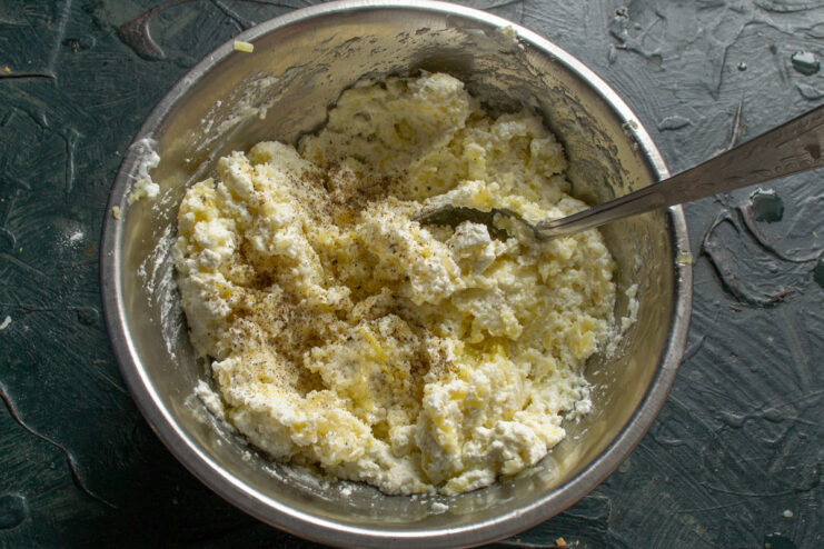 Seasoning the Potato and Tvorog Filling to Perfection Seasoning the potato and tvorog filling with salt and black pepper.