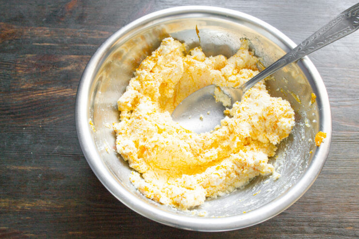 Combining Pumpkin and Tvorog for the Filling A bowl showing the mixed filling of tvorog, sautéed pumpkin, and spices.