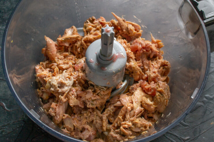 Preparing the Cooked Chicken for Blending into Pâté Deboned cooked chicken meat placed inside a blender bowl.