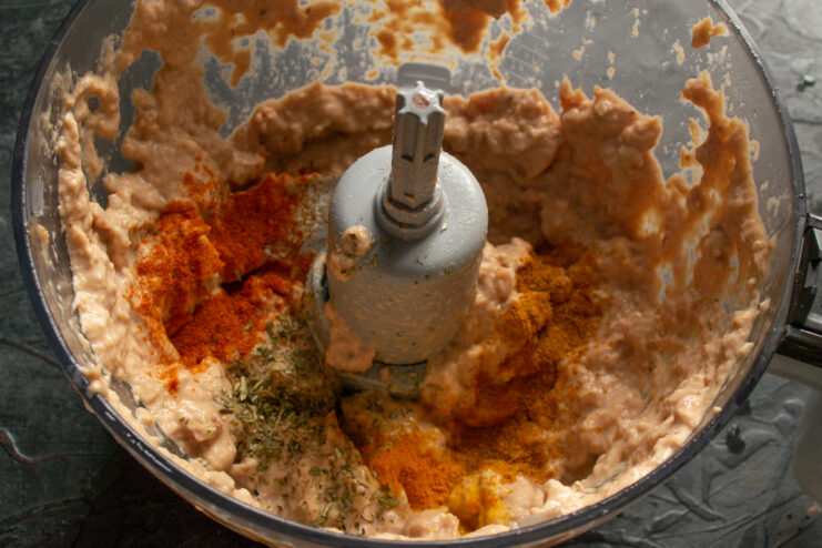 Blending the Pâté Mixture Until Perfectly Smooth Chicken pâté ingredients being pureed in a blender.