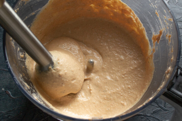 Achieving a Homogeneous and Creamy Pâté Texture A close-up of the smooth, blended chicken pâté mixture in a bowl.