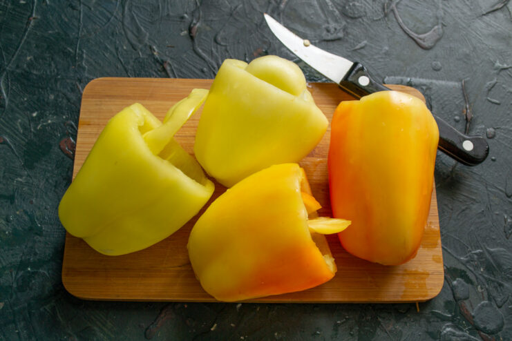 How to Prepare Bell Peppers for Stuffing Cutting the tops off bell peppers and removing the seeds to prepare them for stuffing.