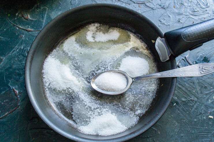 Starting the Caramel Base with Butter and Sugar Cubes of butter and a pile of granulated sugar in a skillet, ready to be melted into caramel.