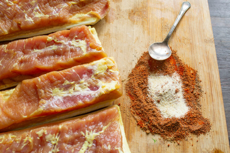 Customizing Your Spice Rub with Garlic Powder Adding a spoonful of garlic powder to a spice blend of paprika and pepper.