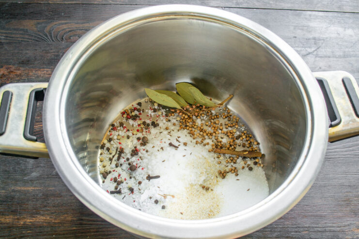 Making the Curing Brine in a Stainless Steel Pot Spices like peppercorns, bay leaves, and coriander in a stainless steel pot for the brine.