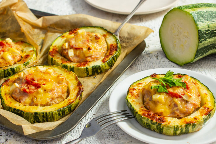 A plate of zucchini baked with minced meat and cheese, ready to be served.