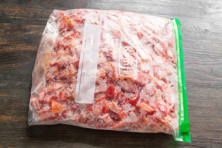 Optimal Freezing Temperature for Vegetables Sealed freezer bags of diced bell peppers lying flat in a freezer drawer.
