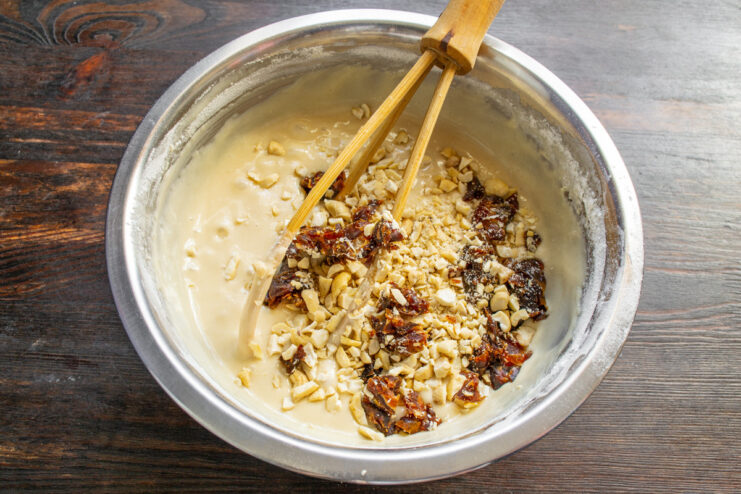Step 6: Preparing the dates for the cake. A pile of finely chopped dates on a cutting board.