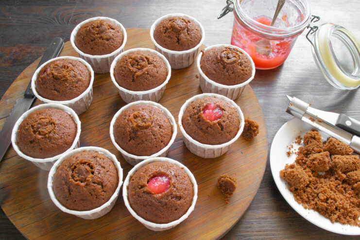 Step 8: Filling the cooled cupcakes with fruit jam Coring a cooled chocolate cupcake to make space for a jam filling.