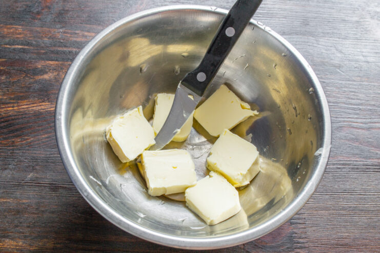 Preparing butter for the cupcake batter A bowl with cubes of softened butter ready for mixing.