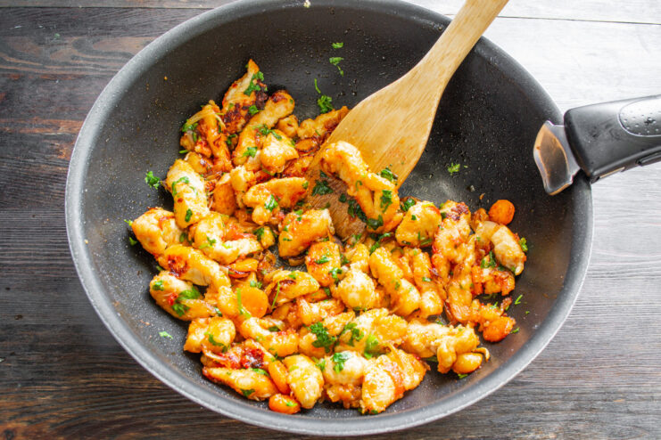 The Perfect 15-Minute Weeknight Dinner The finished chicken and vegetable dish served in the wok, ready to be eaten.