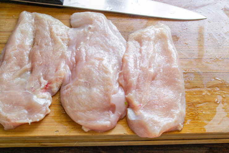 Slicing Chicken Breast into Schnitzels Slicing a chicken breast into even, 1.5 cm thick cutlets for schnitzels.