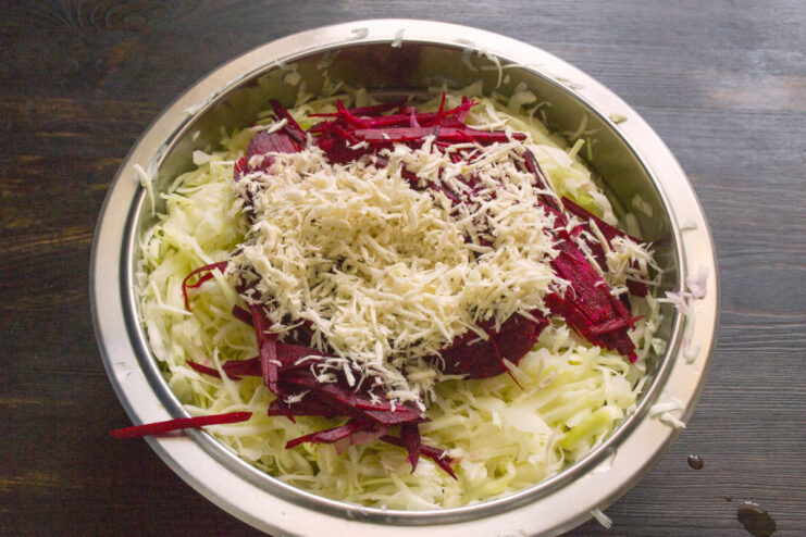 How to prepare fresh horseradish for a spicy kick Fresh horseradish root being grated on a fine grater.