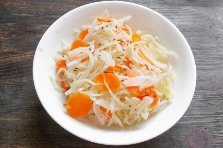 The Final Result: Delicious Homemade Sauerkraut A glass jar filled with ready-to-eat homemade sauerkraut.