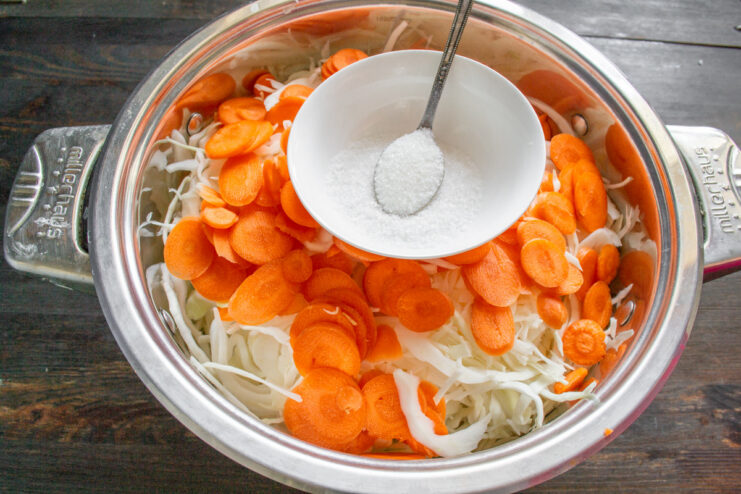The Perfect Salt and Sugar Ratio for Sauerkraut A small bowl containing a mixture of white salt and sugar.