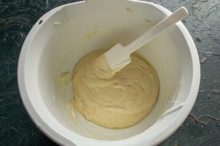 Lightening the Batter with Egg Whites The lemon bun batter after incorporating the first portion of egg whites, looking lighter and more fluid.
