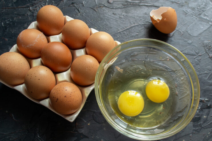 Separating Egg Yolks for an Extra Rich Lemon Curd A bowl with two egg yolks, separated from the whites.