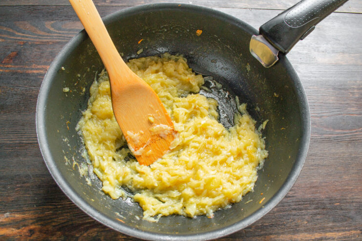 Deglazing the Pan with White Wine for Extra Flavor Pouring white wine into the skillet with caramelized onions to deglaze.