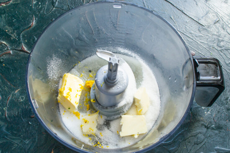 Mixing the muffin batter in a food processor for a quick and easy process Ingredients for blueberry muffin batter being mixed in a food processor bowl.