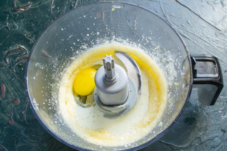 Adding vegetable oil to the batter ensures wonderfully moist muffins Pouring vegetable oil into the food processor with other muffin ingredients.