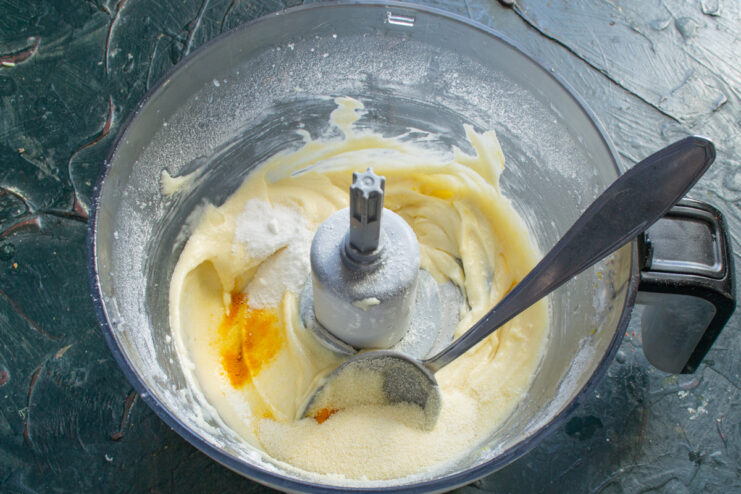 A hint of vanilla enhances the sweet aroma of the muffins Adding vanilla extract to the blueberry muffin batter.