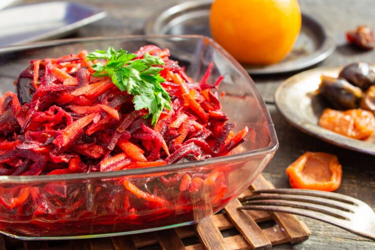 A bowl of freshly made Moroccan beet and carrot salad, garnished and ready to eat.
