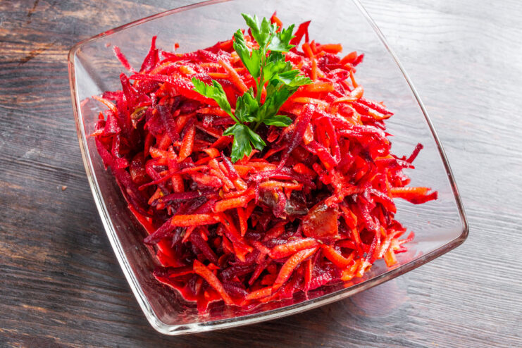 Enjoy this refreshing and flavorful salad as a light meal or a healthy side dish. A serving of the finished Moroccan beet and carrot salad in a decorative bowl.