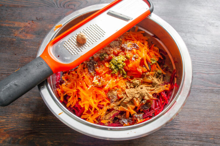 Seasoning the salad with warm spices like cinnamon creates that signature Moroccan flavor. Sprinkling ground cinnamon and sea salt into the bowl with grated vegetables.