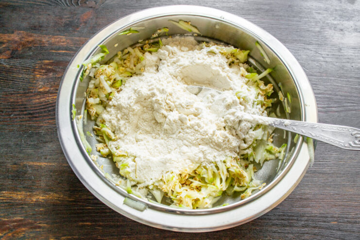Combining Dry Ingredients: Flour and Baking Powder A bowl containing all-purpose flour mixed with baking powder.