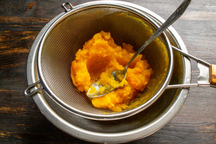How to Make Smooth Pumpkin Purée. Use an immersion blender for the best texture. An immersion blender puréeing cooked pumpkin in a white bowl to create a smooth base for the pancake batter.