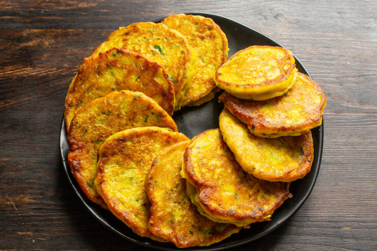 Draining Excess Oil from Fried Pancakes. This step keeps them from being greasy. Golden-brown pumpkin pancakes resting on a paper towel to absorb excess oil.